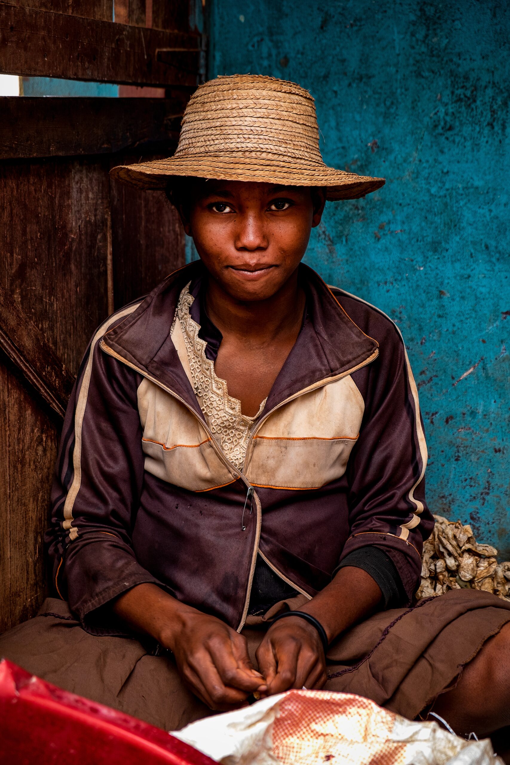 AMBALAVAO, MADAGASCAR - Aug 18, 2019: A girl working in a silk factory in the city of Ambalavao